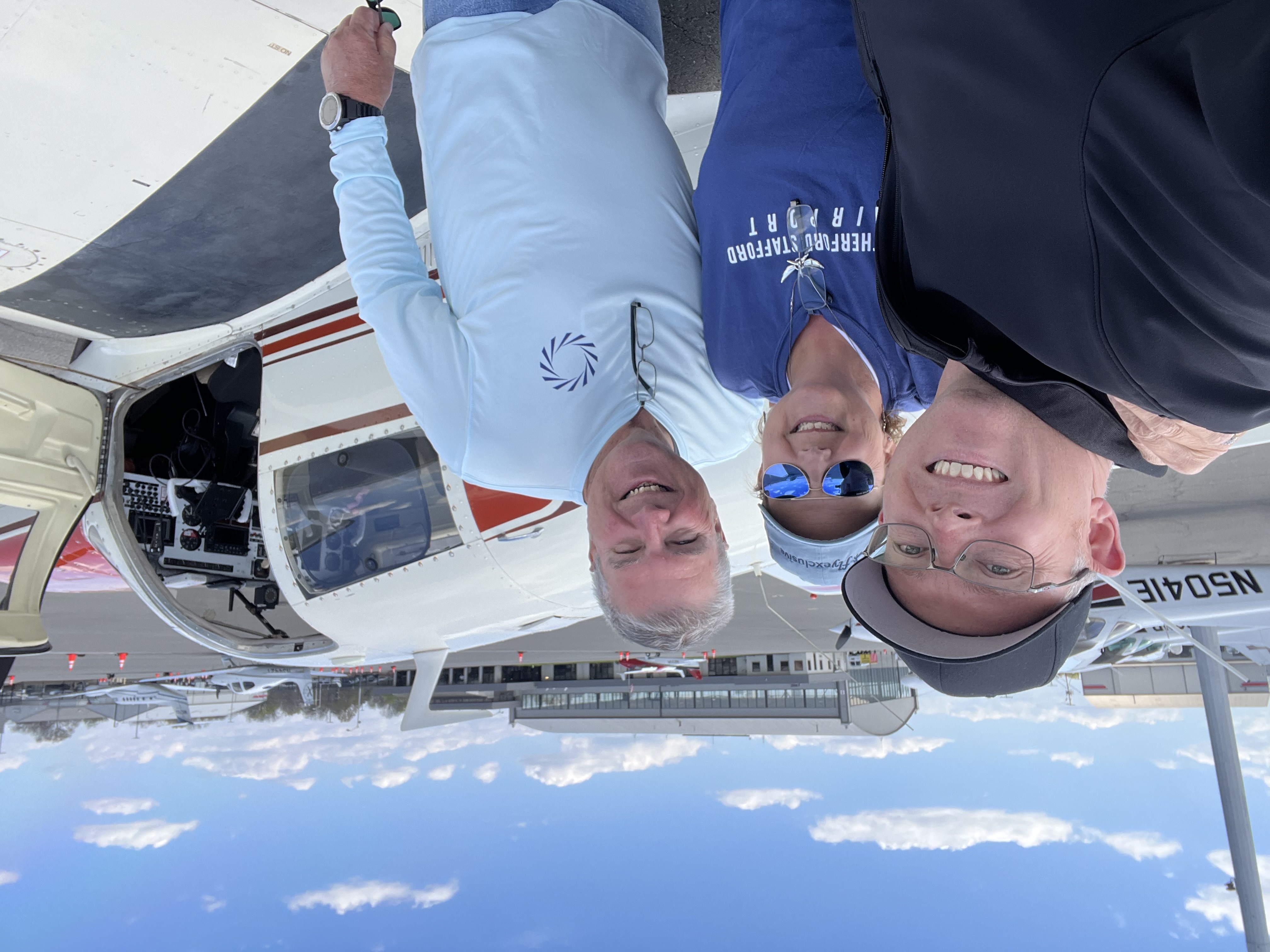 Travis Alkire with pilots at the airport